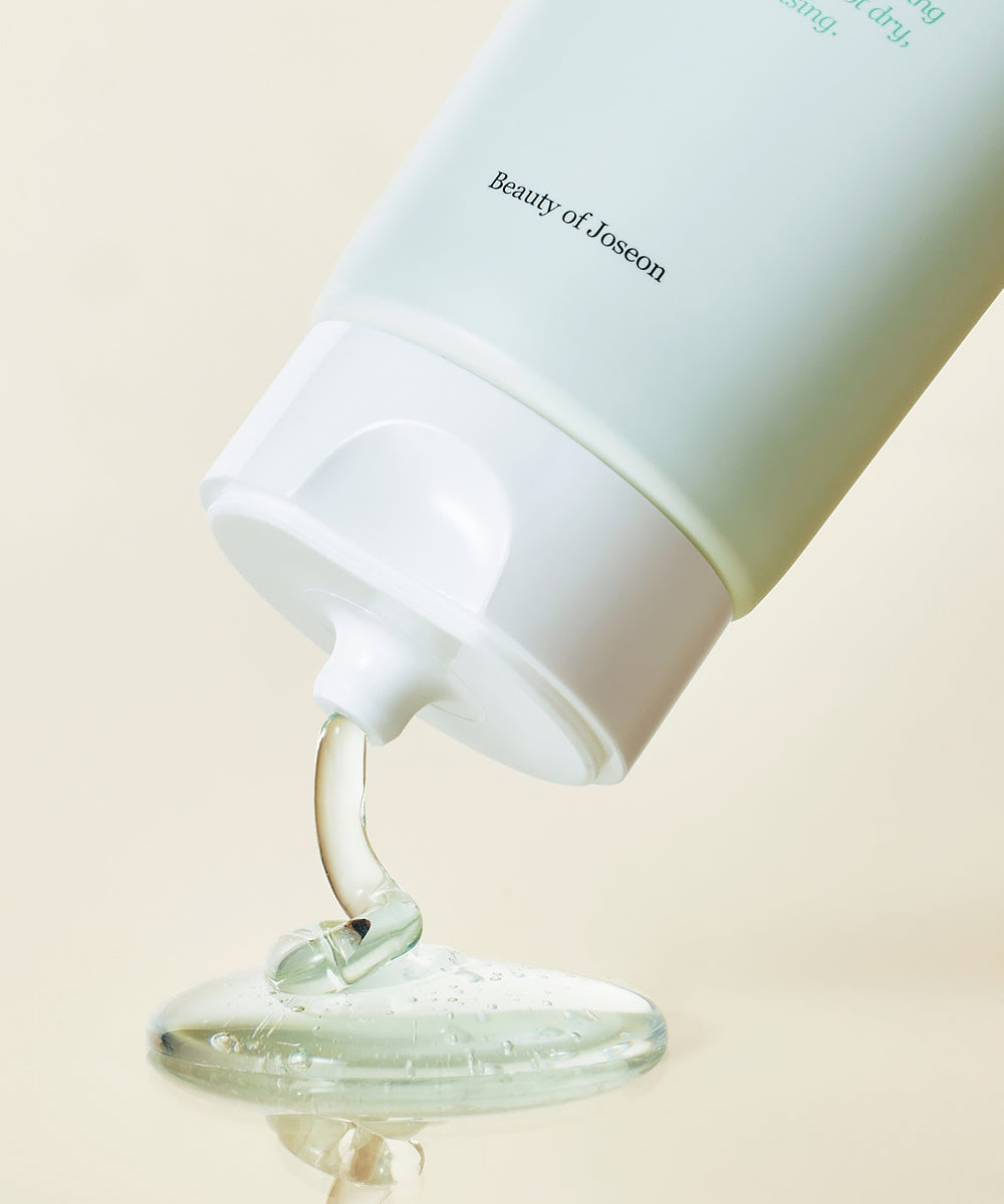 Beauty of Joseon skincare product with a droplet of gel on a beige background