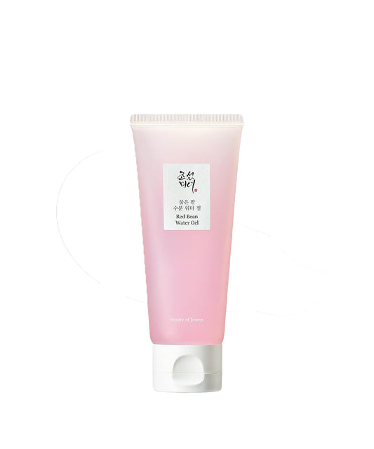 Pink tube of skincare product on a white background