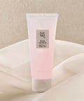 Tube of pink gel with a label on a beige background