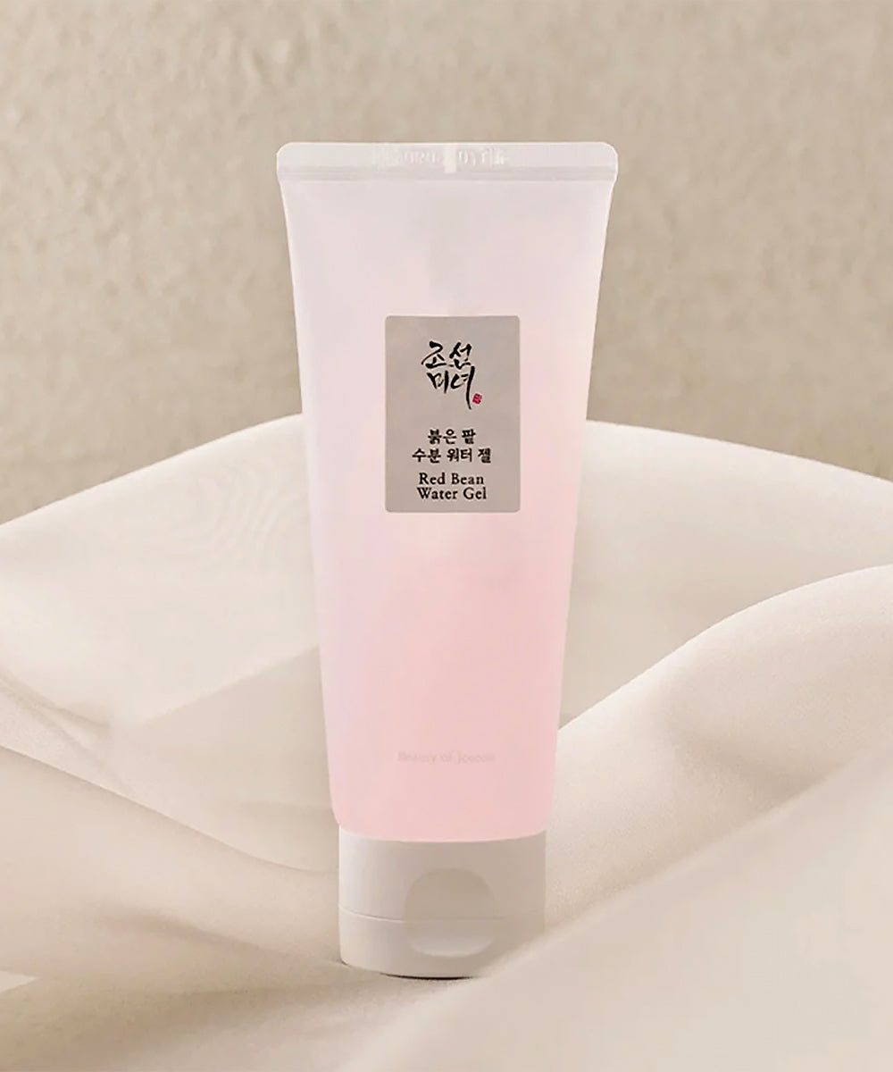 Tube of pink gel with a label on a beige background