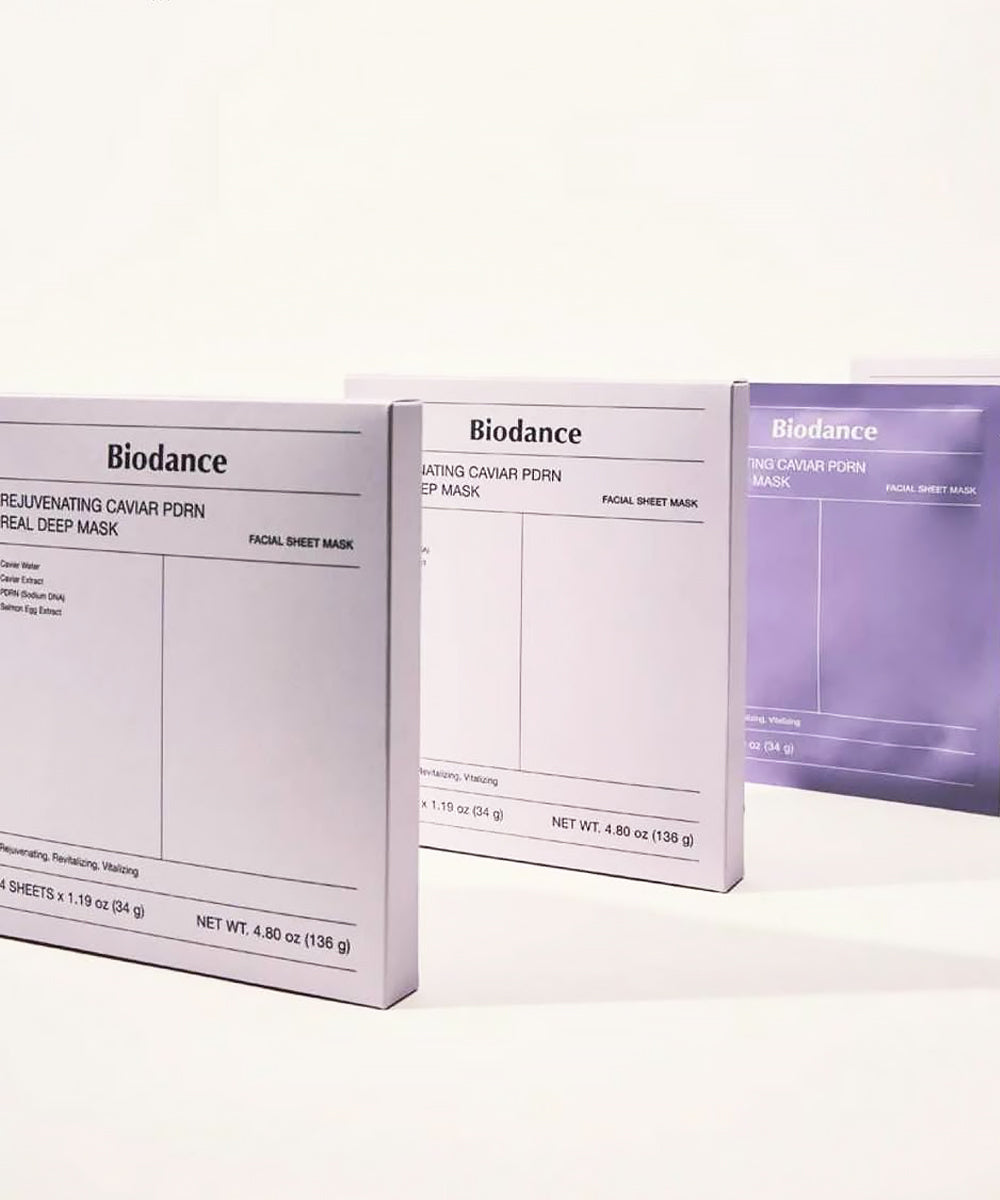 A perspective view of three white mask boxes lined up in a row against a clean, white background.