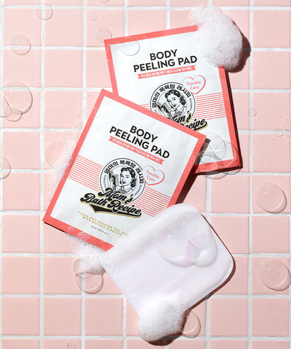 Body peeling pads with a white pad on a pink tiled background