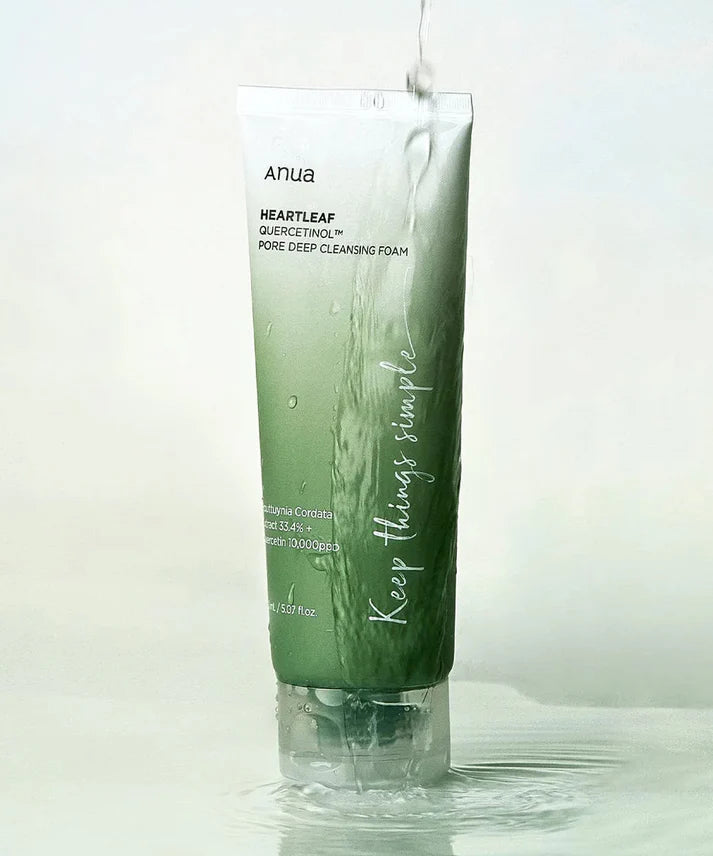 Green tube of skincare product with text on a light background