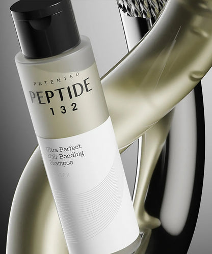 Shampoo bottle labeled 'Patented Peptide 132' with a blurred background