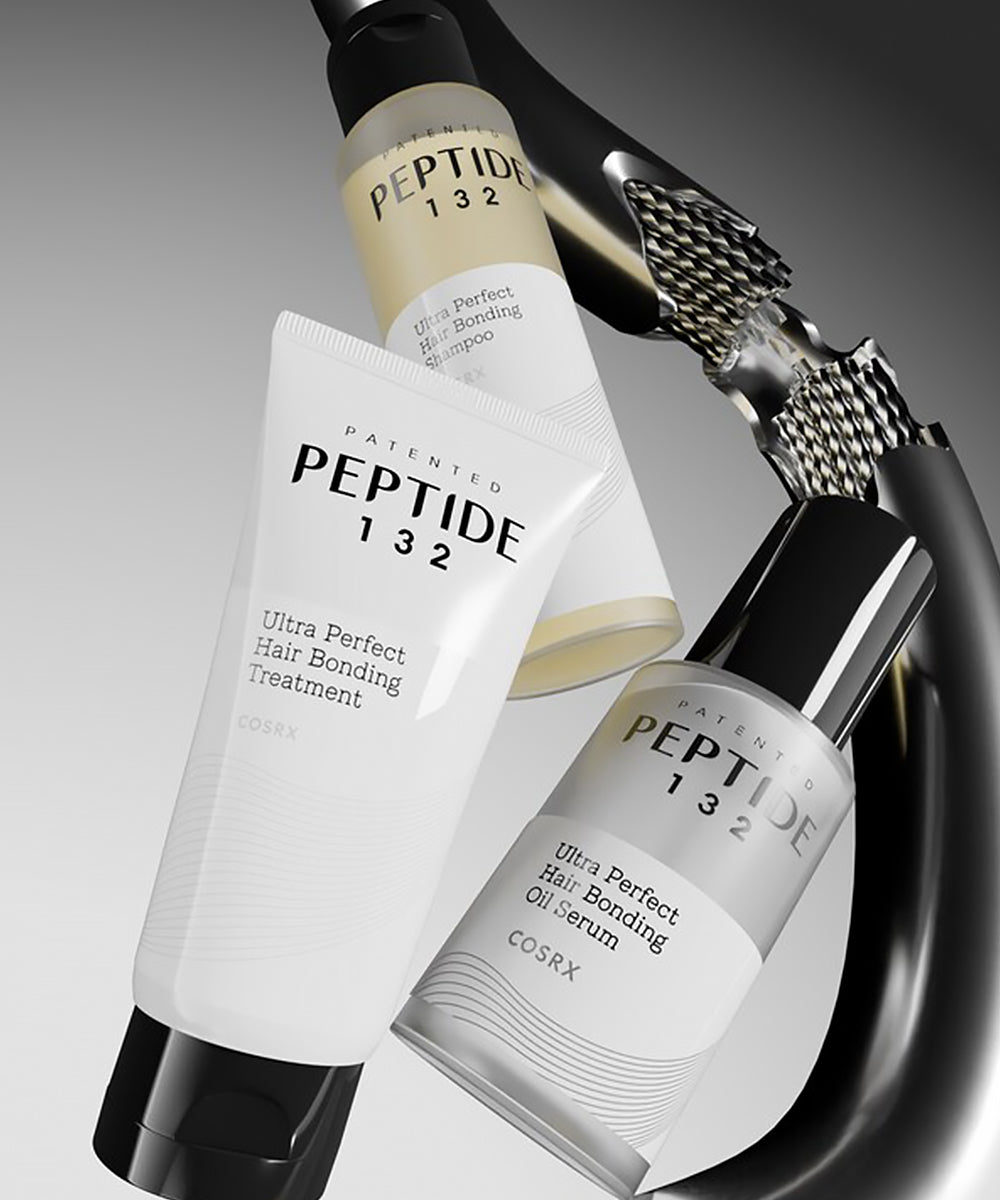 CosRX Peptide 132 hair care products with a hair straightener on a gray background