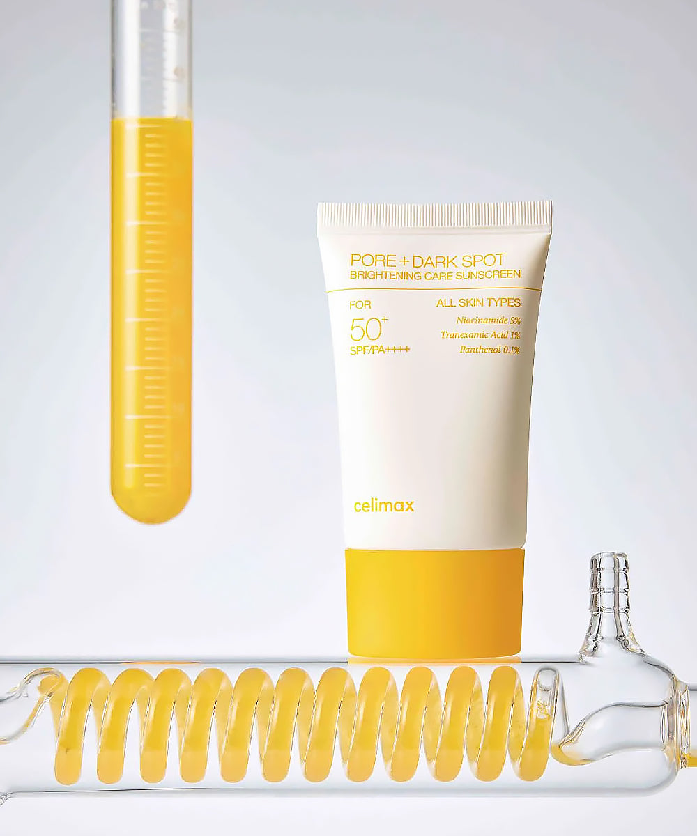Cosmetic tube with yellow liquid and a bottle cap on a light gray background