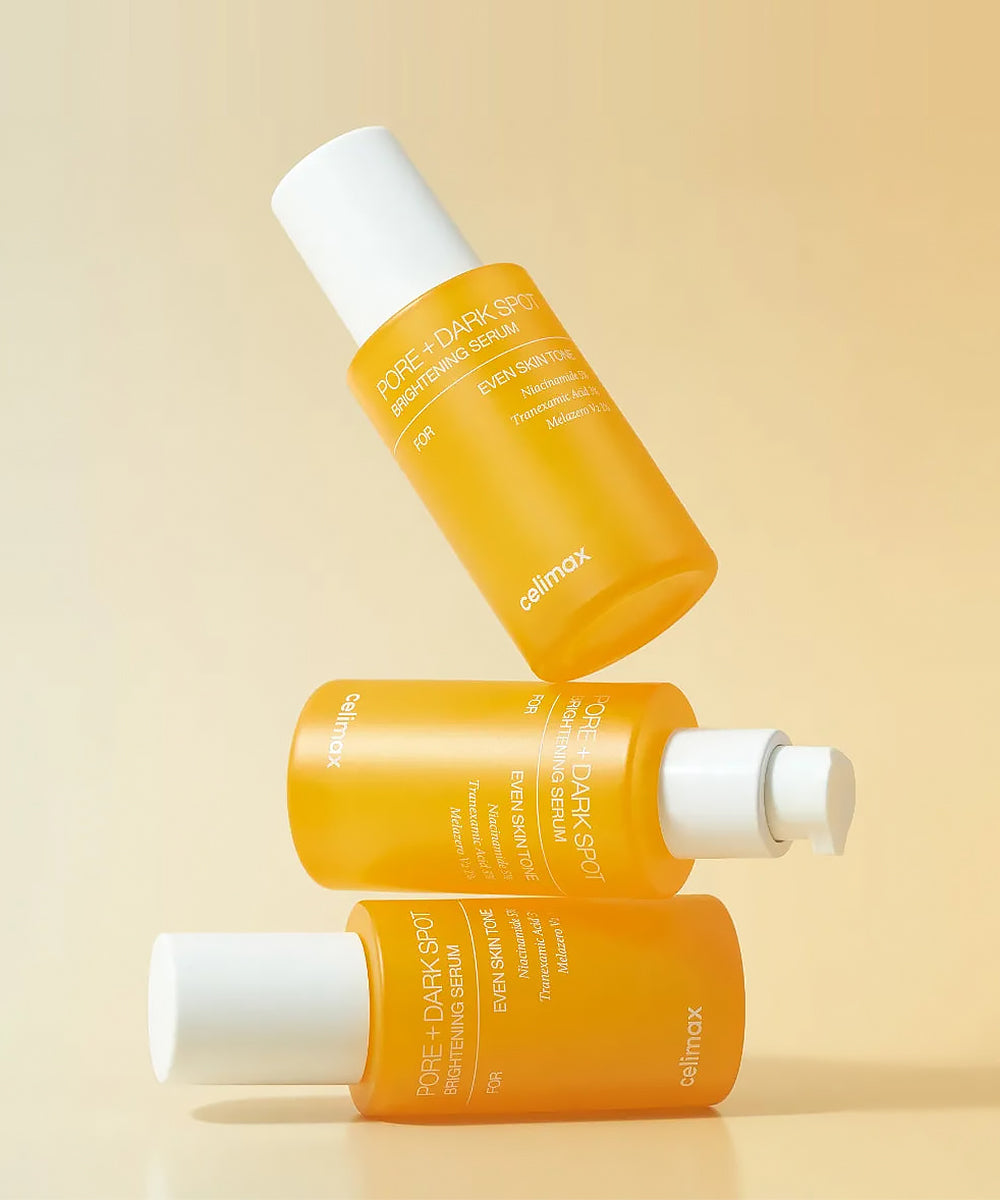 Three bottles of Celimax skincare product on a beige background