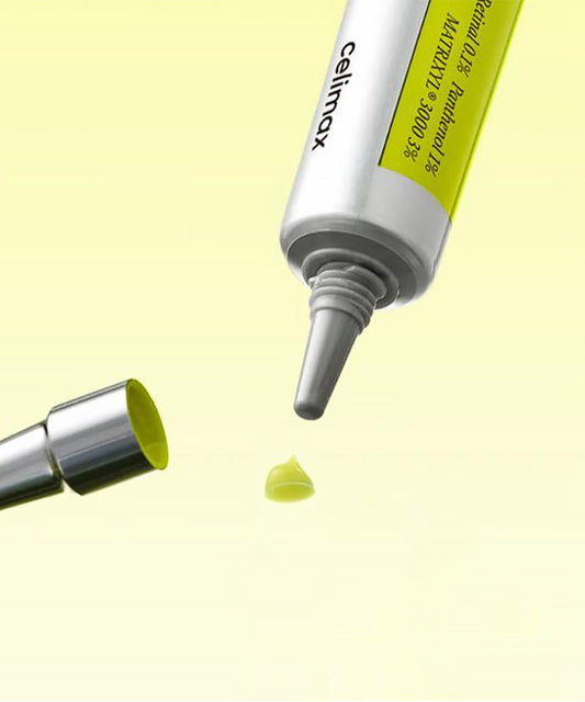 Close-up of a tube labeled 'celimax' with a yellow cap on a light yellow background