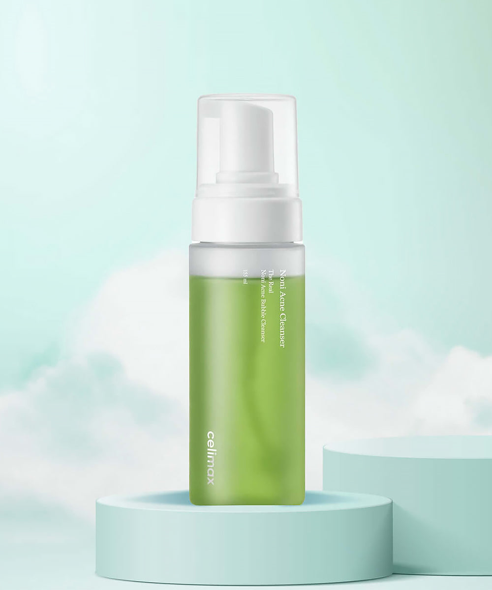 Green skincare bottle with white cap on a light blue background