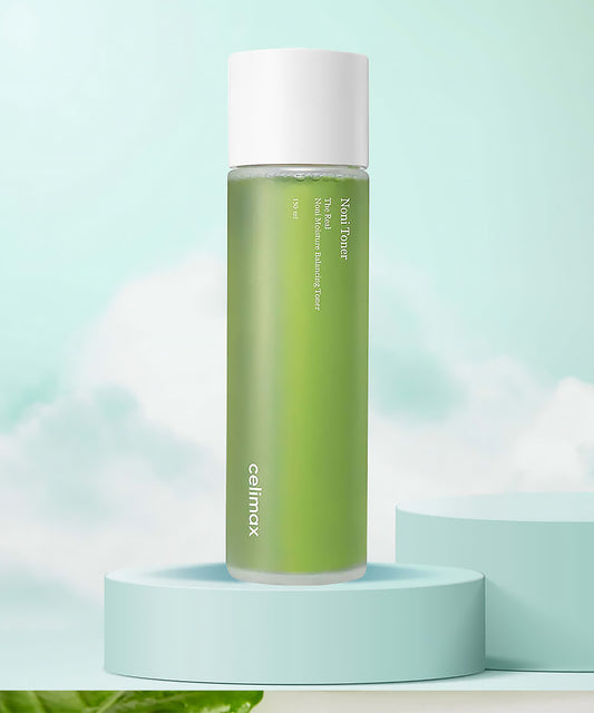 Green skincare bottle with white cap on a light blue background