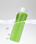 Green bottle with white cap on a gray background