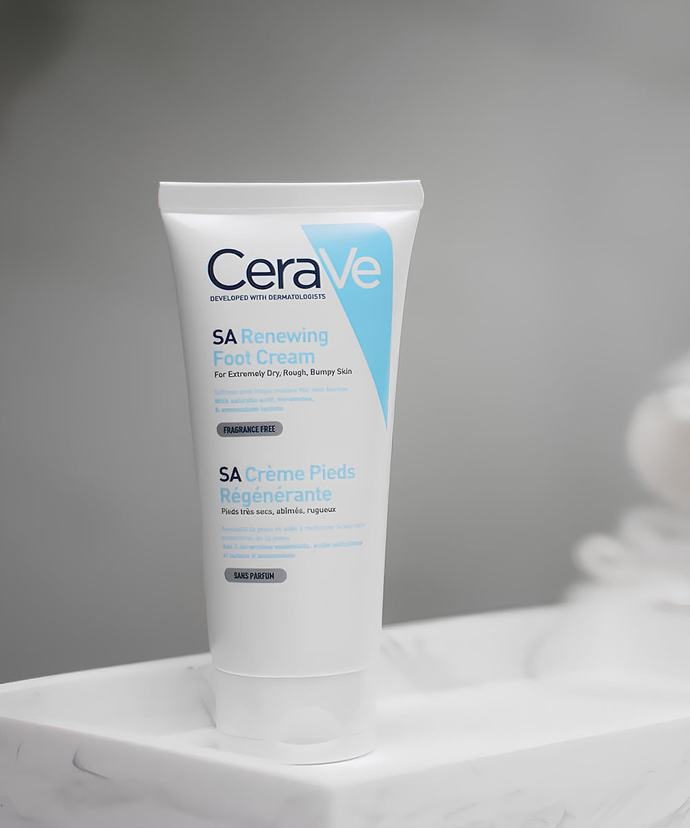 CeraVe SA Renewing Foot Cream tube on a white surface with a gray background