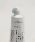 Skincare bottle labeled 'Barrier Cream 147' by Dr. Althea on a light gray background