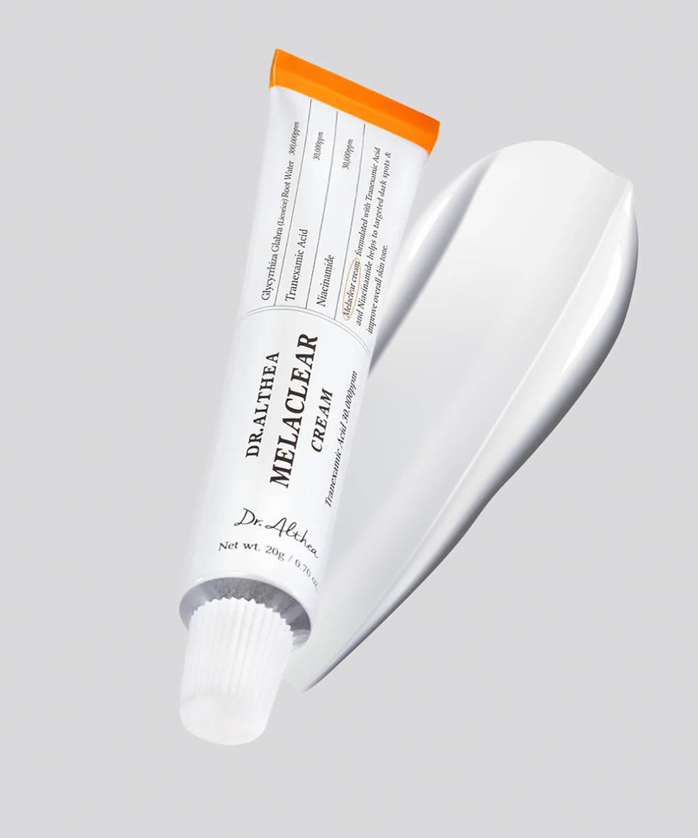A close-up of the Dr.Althea Melaclear Cream texture, showing a smooth, creamy white consistency being spread to demonstrate its rich and hydrating feel
