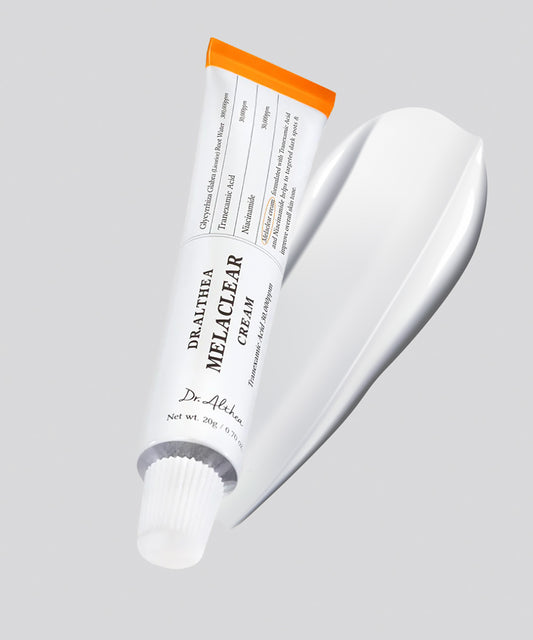 A close-up of the Dr.Althea Melaclear Cream texture, showing a smooth, creamy white consistency being spread to demonstrate its rich and hydrating feel