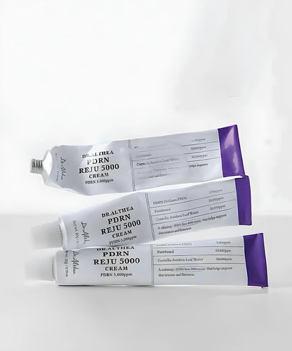 Three tubes of Dr. Althea Reju 5000 Cream on a white background