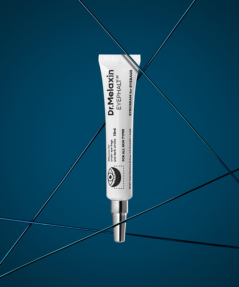 A hand holding the Dr. Melaxin Eyephalt Eye Cream tube, showcasing the precision applicator tip designed for targeted treatment of under-eye bags