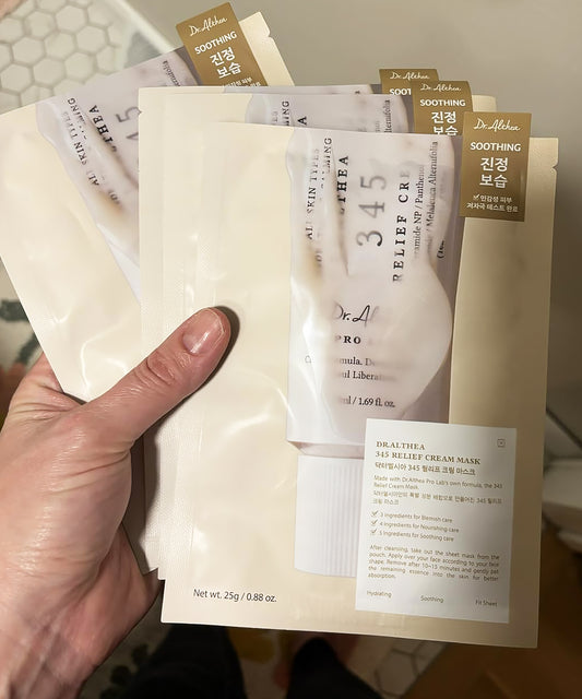 Close-up of the Dr. Althea 345 Relief Cream Mask being removed from its pouch, showcasing the thick, nourishing white cream essence designed for skin barrier repair