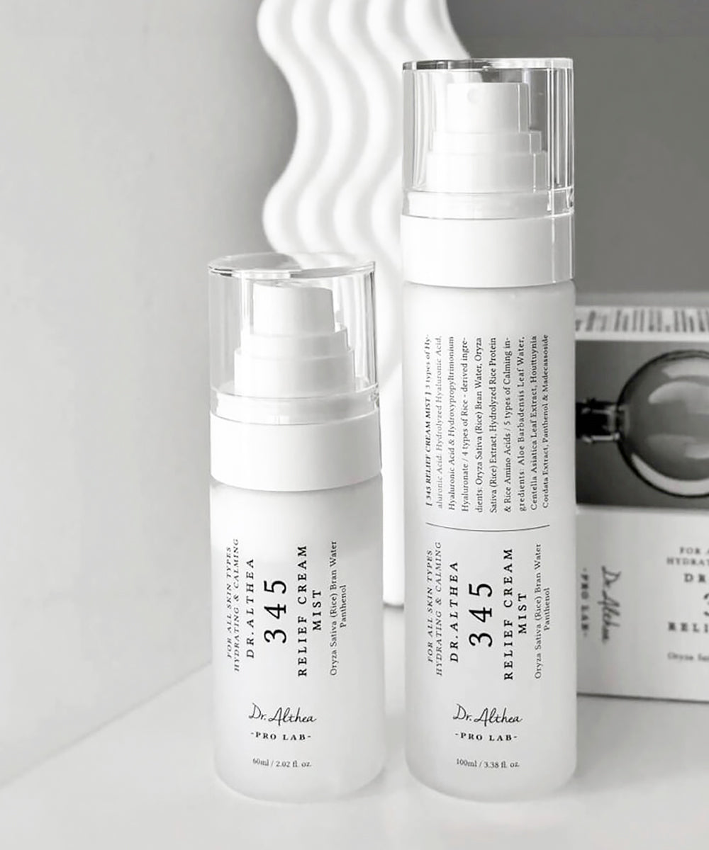 Two skincare products with labels on a neutral background