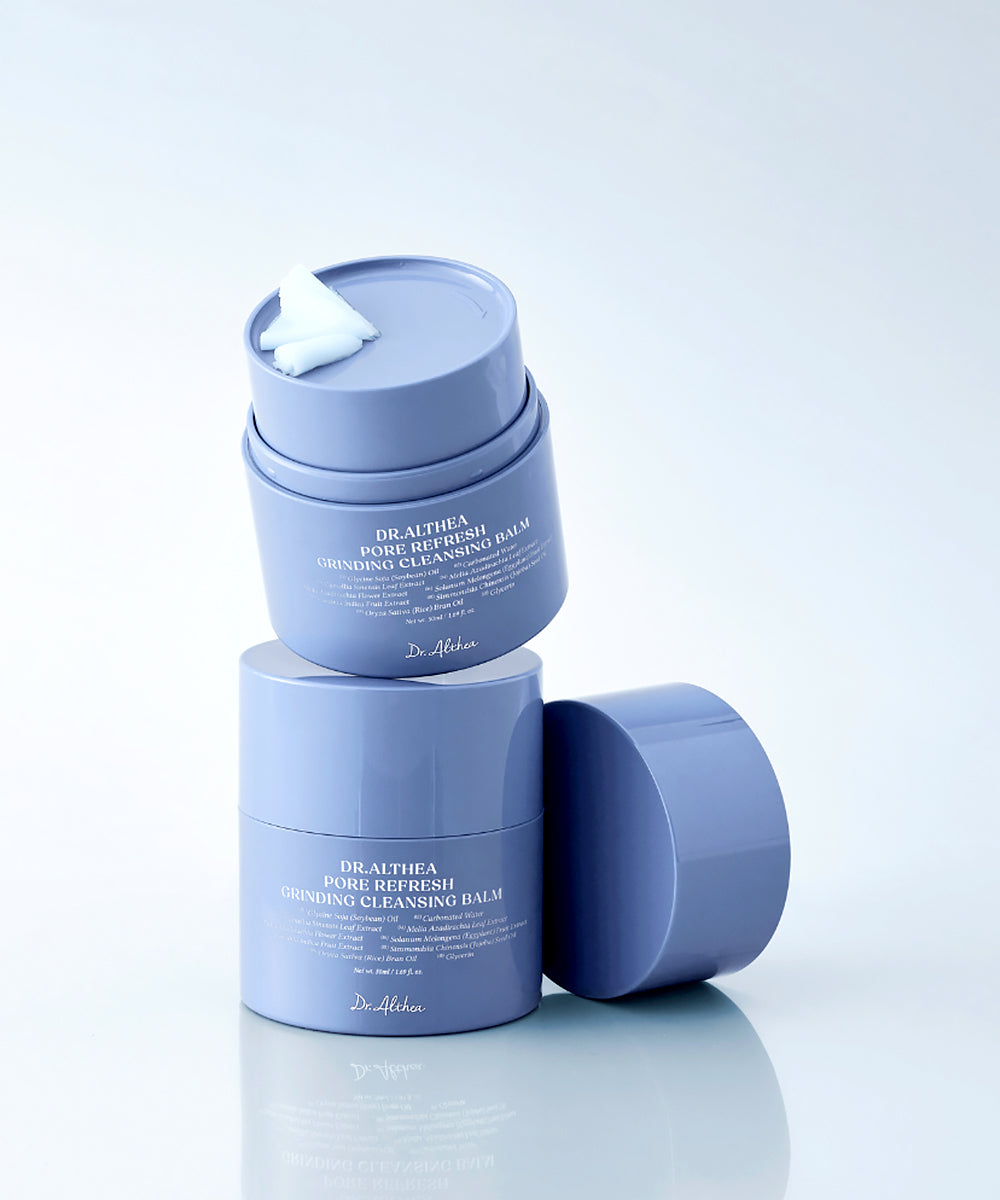 Two blue skincare containers with a white background