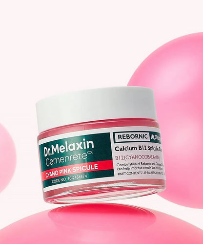 A hand holding the Dr. Melaxin Calcium B12 Spicule Cream tube, demonstrating its sleek, ergonomic design and professional medical-grade branding