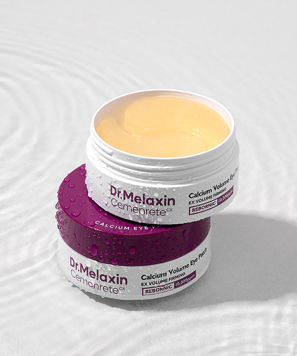 A close-up of a hand holding the Dr. Melaxin Cemenrete Calcium Volume Eye Patch jar, showcasing the premium, medical-grade packaging design