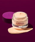 Dr. Melaxin Cemenrete eye cream jar with a sample on a purple background