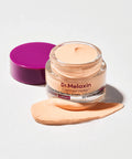 Dr. Melaxin Cemenrete eye cream jar with a purple lid on a white background
