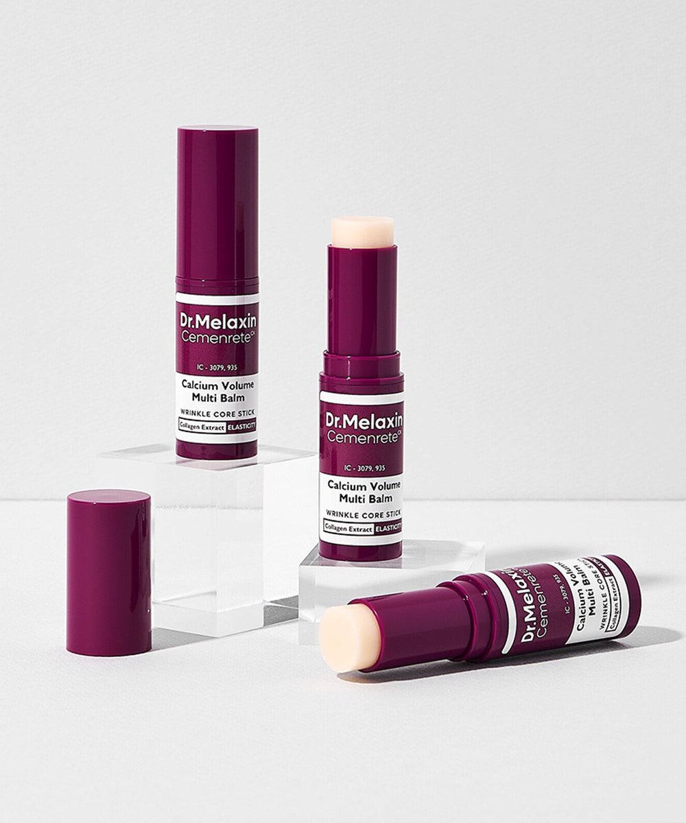 A product group display featuring three Dr. Melaxin Cemenrete Multi Balms arranged on clear acrylic blocks, illustrating the portable design of the wrinkle core stick