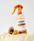 Dr. Melaxin peel shot spray bottle with a small toy on a white background