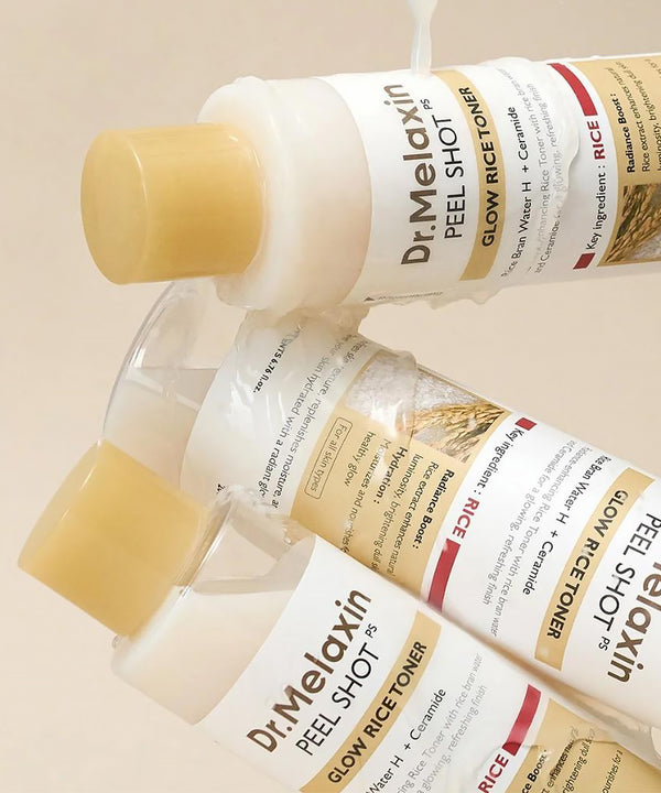 Dr. Melaxin glow rice toner bottles on a beige background