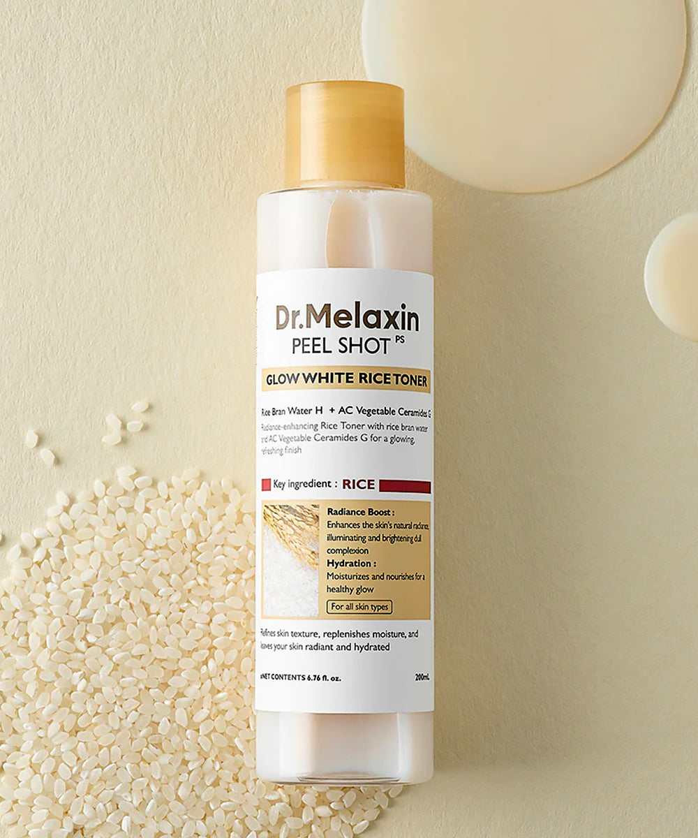 Dr. Melaxin Peel Shot Glow White Rice Toner bottle with rice grains on a beige background