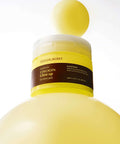 Yellow bottle with a label on a white background