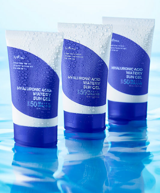 Three tubes of Hyaluronic Acid Watery Sun Gel on a blue water background
