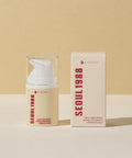 Product display photograph showing the K-SECRET Seoul 1988 Cream pump bottle standing next to its branded retail cardboard box on a textured surface against a neutral background
