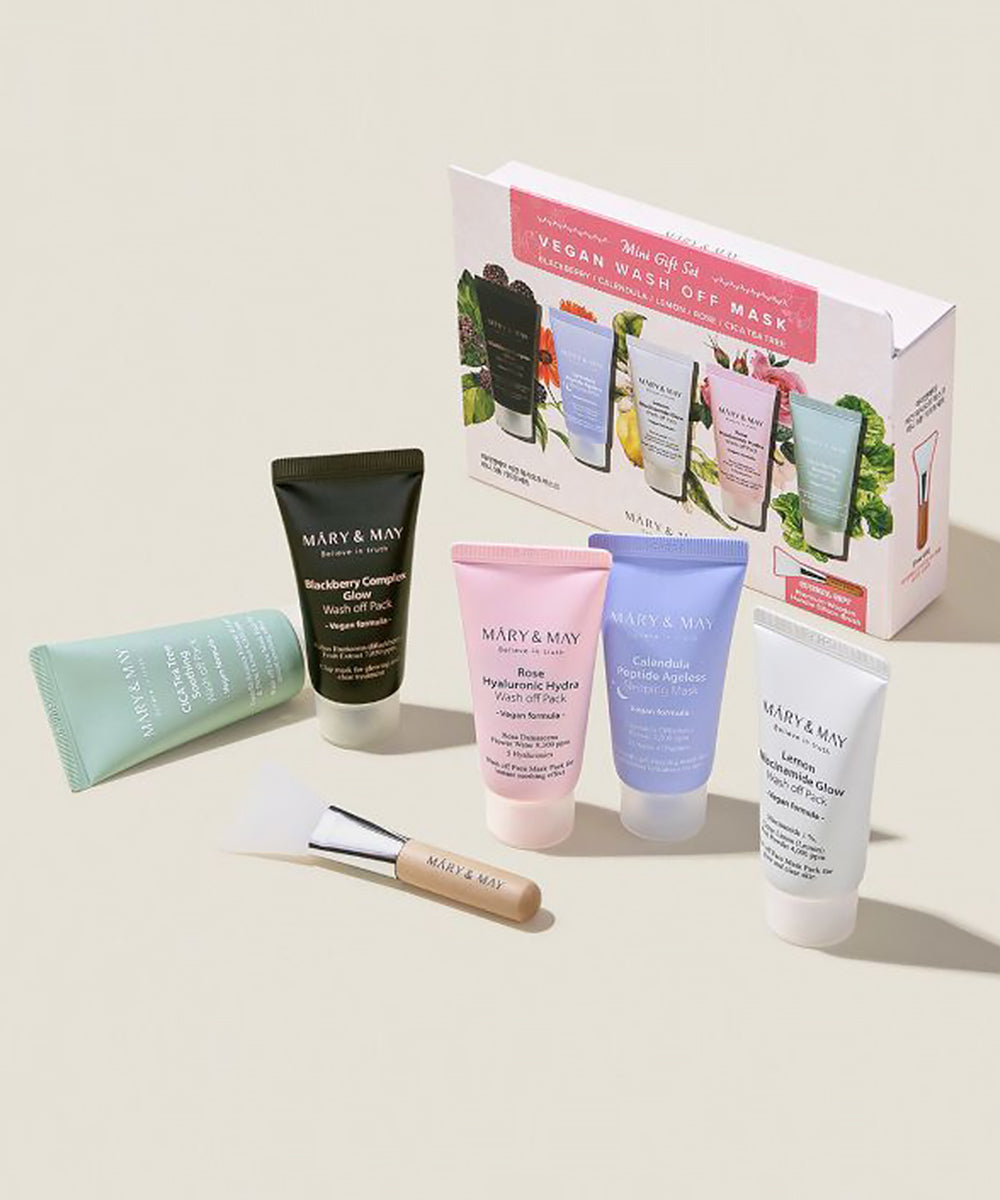 A group shot of the unboxed Mary & May Mini Gift Set displaying five assorted vegan mask tubes and the premium wooden handle silicone applicator brush on a neutral background