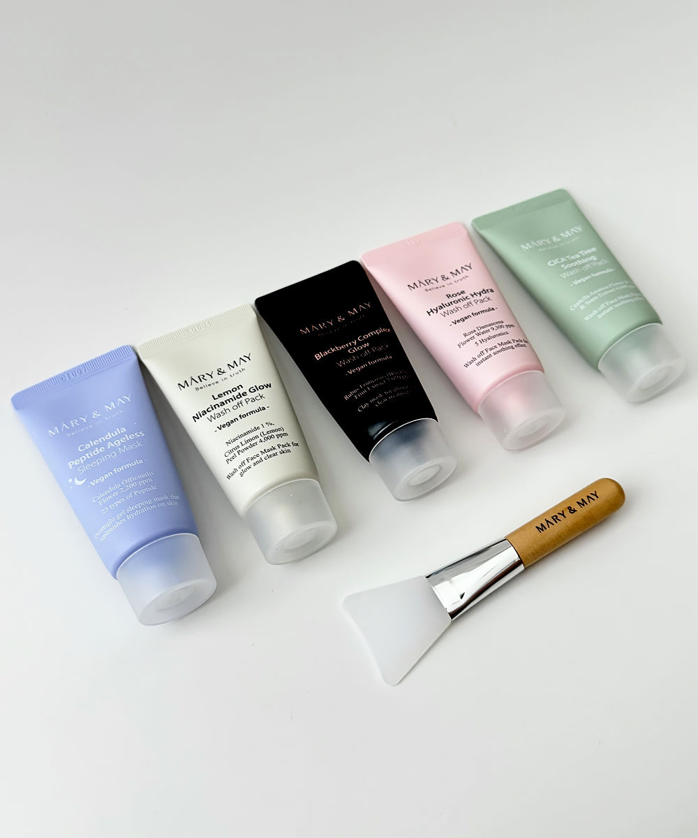 A neat line-up of five Mary & May vegan wash-off masks including the Calendula Sleeping Mask and four clay-style masks, showcasing the sleek, color-coded tube designs