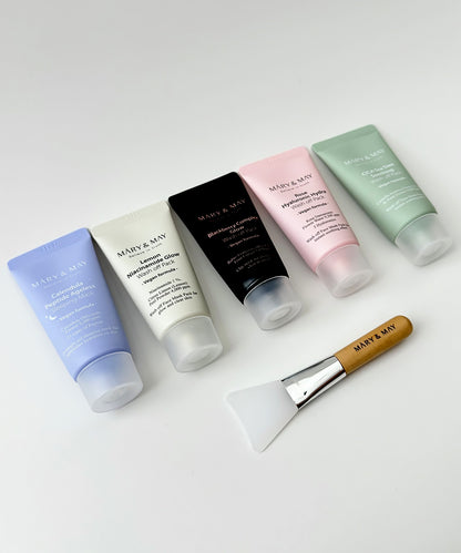 A neat line-up of five Mary & May vegan wash-off masks including the Calendula Sleeping Mask and four clay-style masks, showcasing the sleek, color-coded tube designs