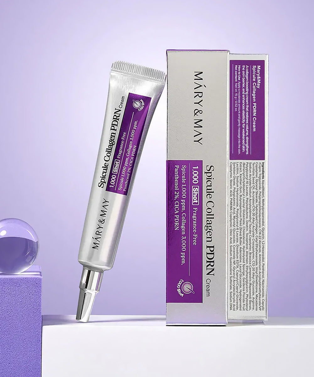 The Mary & May Spicule Collagen PDRN Cream tube standing next to its silver and purple retail box, showcasing the professional packaging and ingredient list