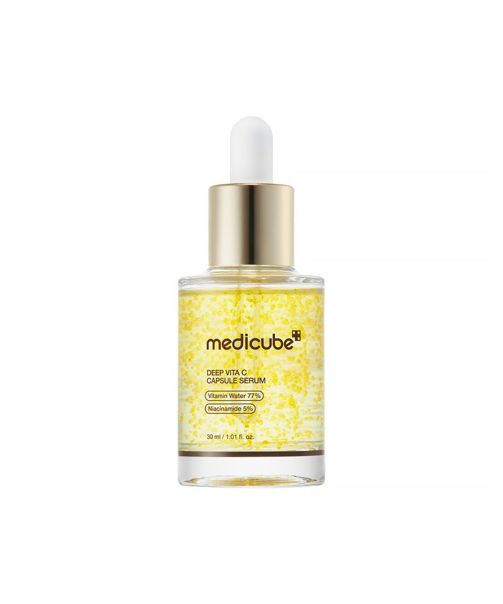 Front-facing product shot of the Medicube Deep Vita C Capsule Serum 30ml glass bottle with a gold dropper, against a clean white background