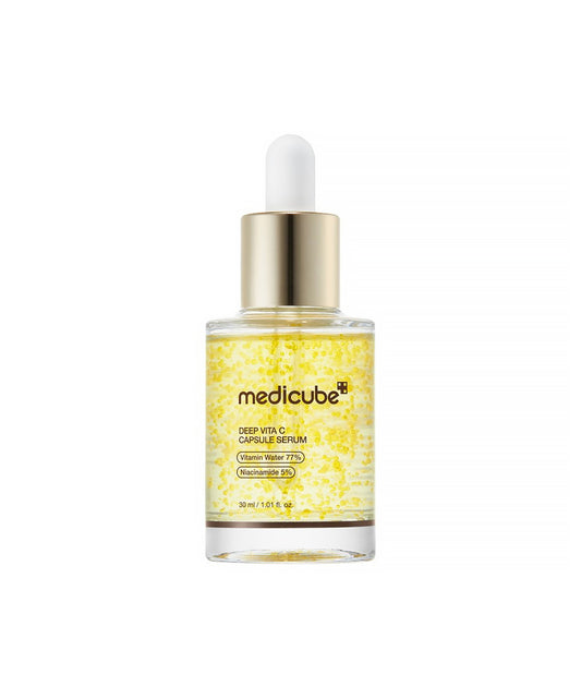 Front-facing product shot of the Medicube Deep Vita C Capsule Serum 30ml glass bottle with a gold dropper, against a clean white background