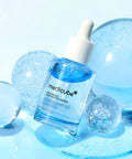 Medicube hyaluronic peptide serum with glossy hydration spheres on blue background