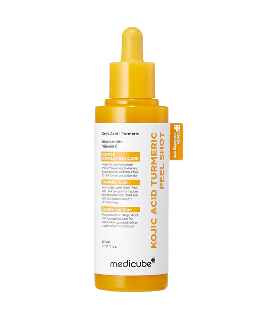 Front-facing product shot of the Medicube Kojic Acid Turmeric Peel Shot (30ml) glass bottle with its minimalist white and yellow packaging box