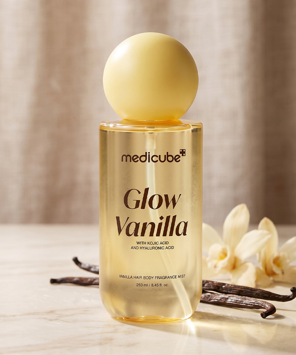 Medicube Vanilla Hair & Body Fragrance Mist 250ml on marble with vanilla beans and orchids, cozy vanilla fragrance