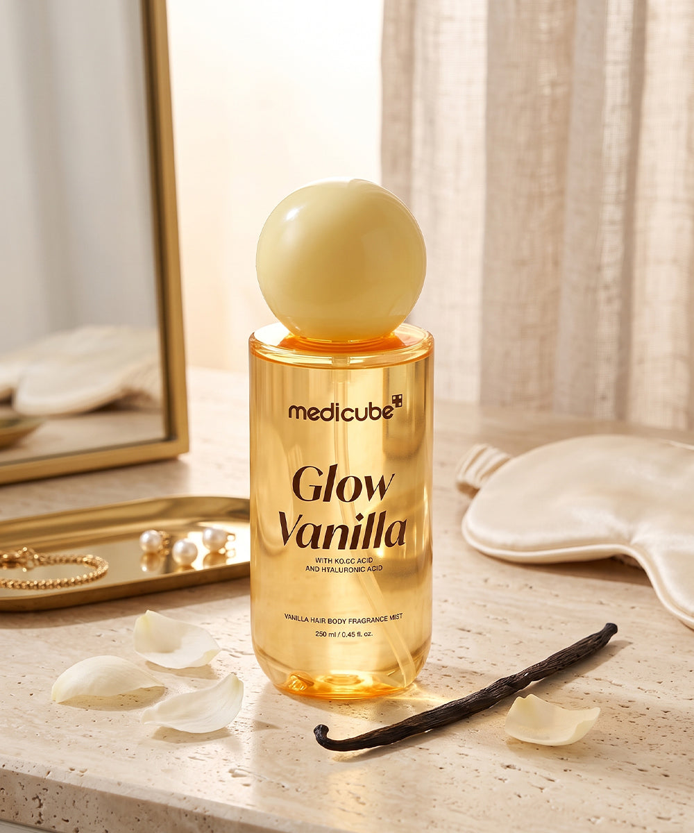 Medicube Vanilla Hair & Body Fragrance Mist 250ml styled on marble with petals and sleep mask, everyday vanilla body mist