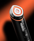 Black and orange electronic device with digital display on a dark background
