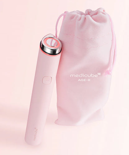Pink beauty device with 'medicube' branding on a light pink background