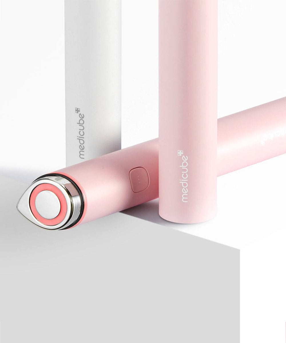 Pink electronic device with 'medicube' branding on a white background