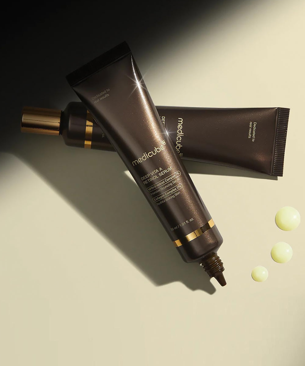 Cosmetic tube and packaging with 'medicube' branding on a beige background