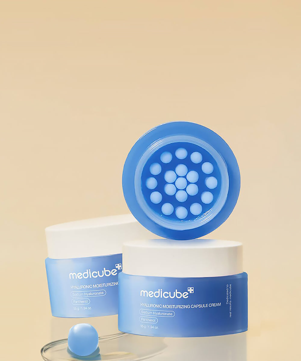 Medicube skincare product with blue cap and container on a beige background